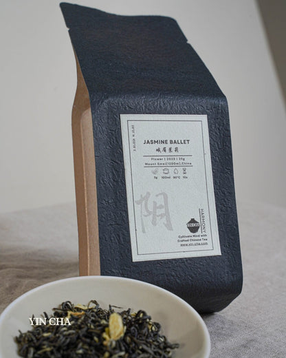 Jasmine Ballet tea packaging with a bowl of loose jasmine green tea leaves